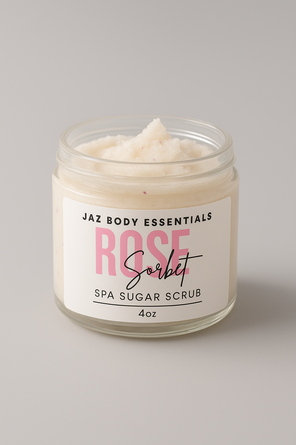 Jar of Jaz Body Essentials Rose Sorbet Spa Sugar Scrub on a gray background