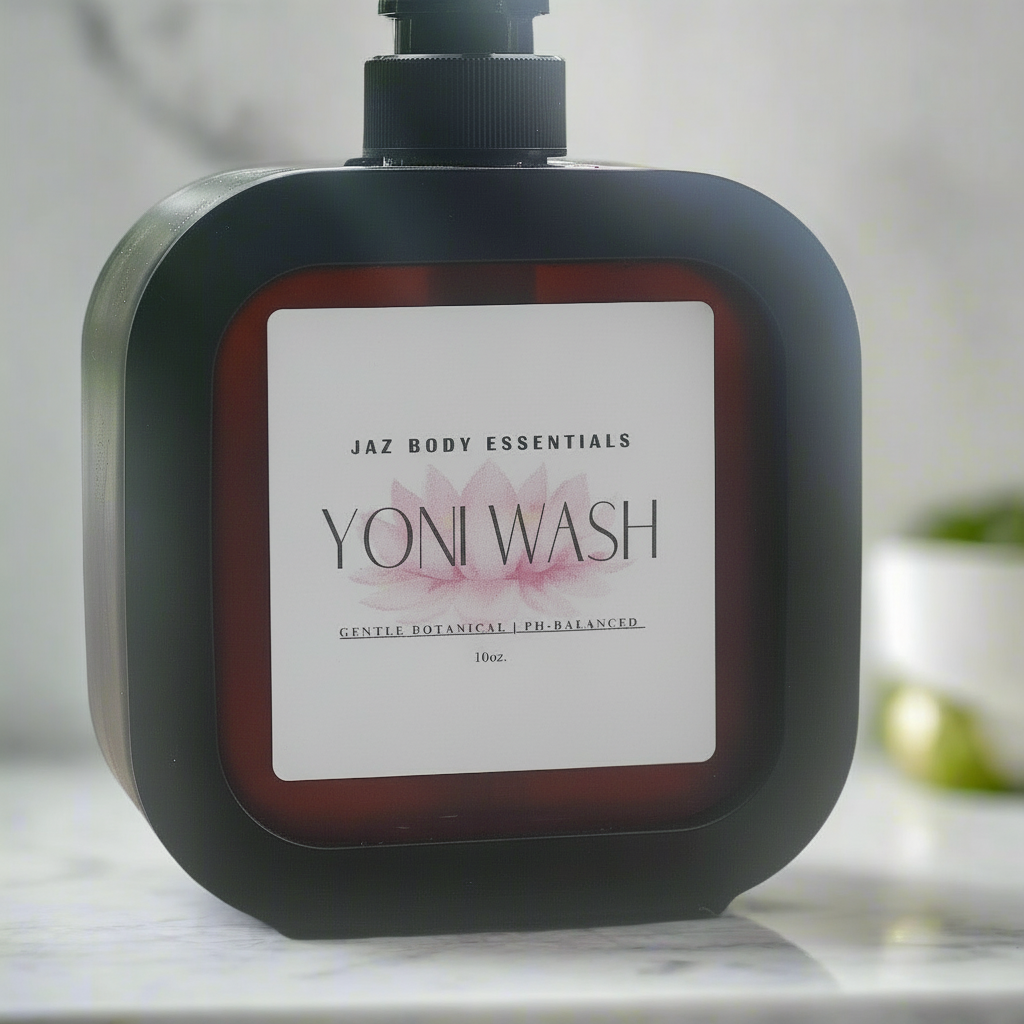Bottle of Jaz Body Essentials Yoni Wash Gel on a marble surface with a blurred background