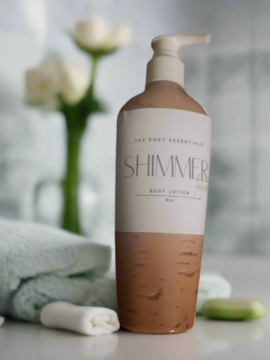 A pump bottle of shimmer body lotion with a gradient color design, transitioning from a beige lotion at the top to a bronze shimmer at the bottom.