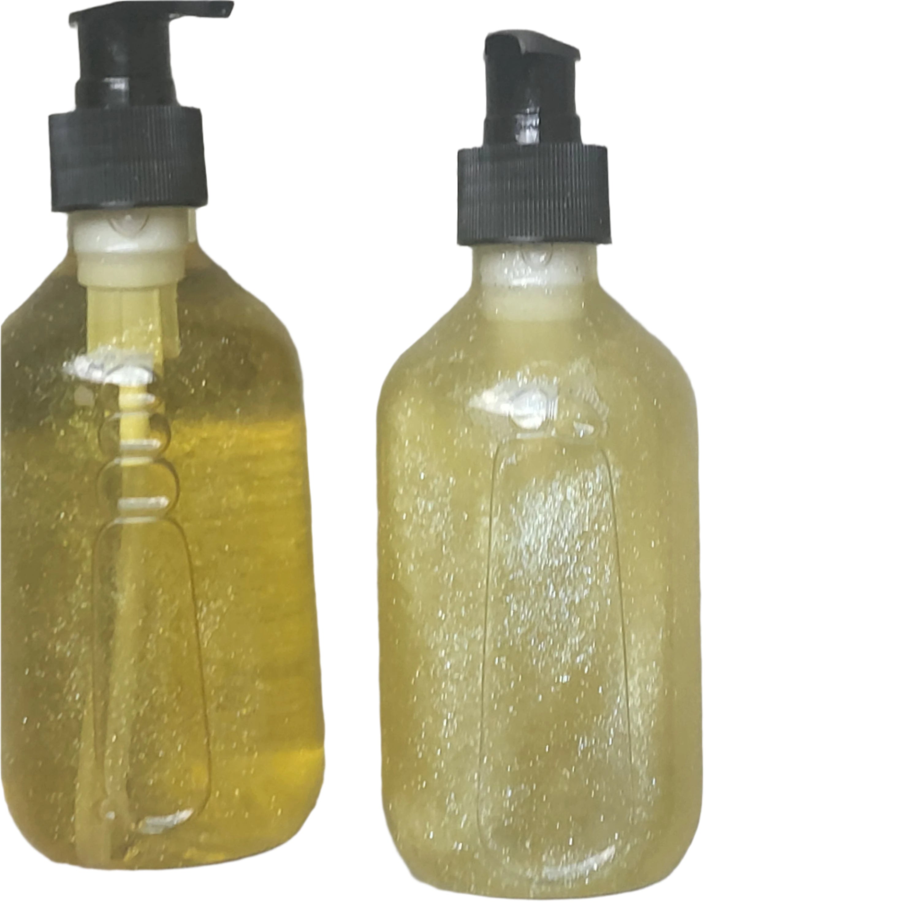Two bottles of yellow liquid with black pumps on a gray surface