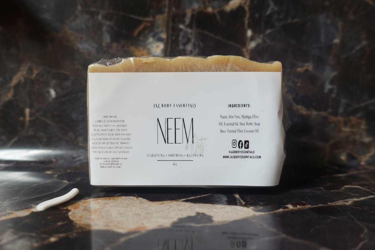 Bar of soap with a label on a marble surface